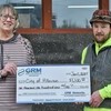 Anthony Trower, GRM Networks Combination Technician, pictured above right, presented the grant to Allerton City Clerk Melissa Niday.