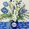 A blue delphinium and white snapdragon arrangement of flowers is sure to be a hit for Royals fans. Photo by Michele Warmund.