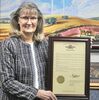 Peggy Boulware retires from Grundy County Electric on February 17th after working there for 33 years. Pictured above is a resolution honoring Peggy for her retirement from Rep. Mazzie Boyd.