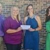 In the photo from left to right are :
	Clint Vanatta &amp; Cindy Crone of BTC bank presenting Heather ­Swymeler and Jessica Adkins of Access II a check.