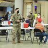 Members of the National Guard assist Daviess County Health Department administer Covid vaccine last week at the Spillman Event Center in Jamesport.
