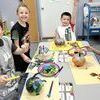 TC Elementary students who attended tutoring session this week painted and carved pumpkins and were able to work at stations in the class room.  Above, Jase Strouse, Zayne Hutchinson, Zander Ackley and Kamden King paint ­pumpkins.