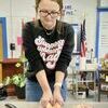 Hailey Eads works on butchering a chicken in Ag Science 2 class.